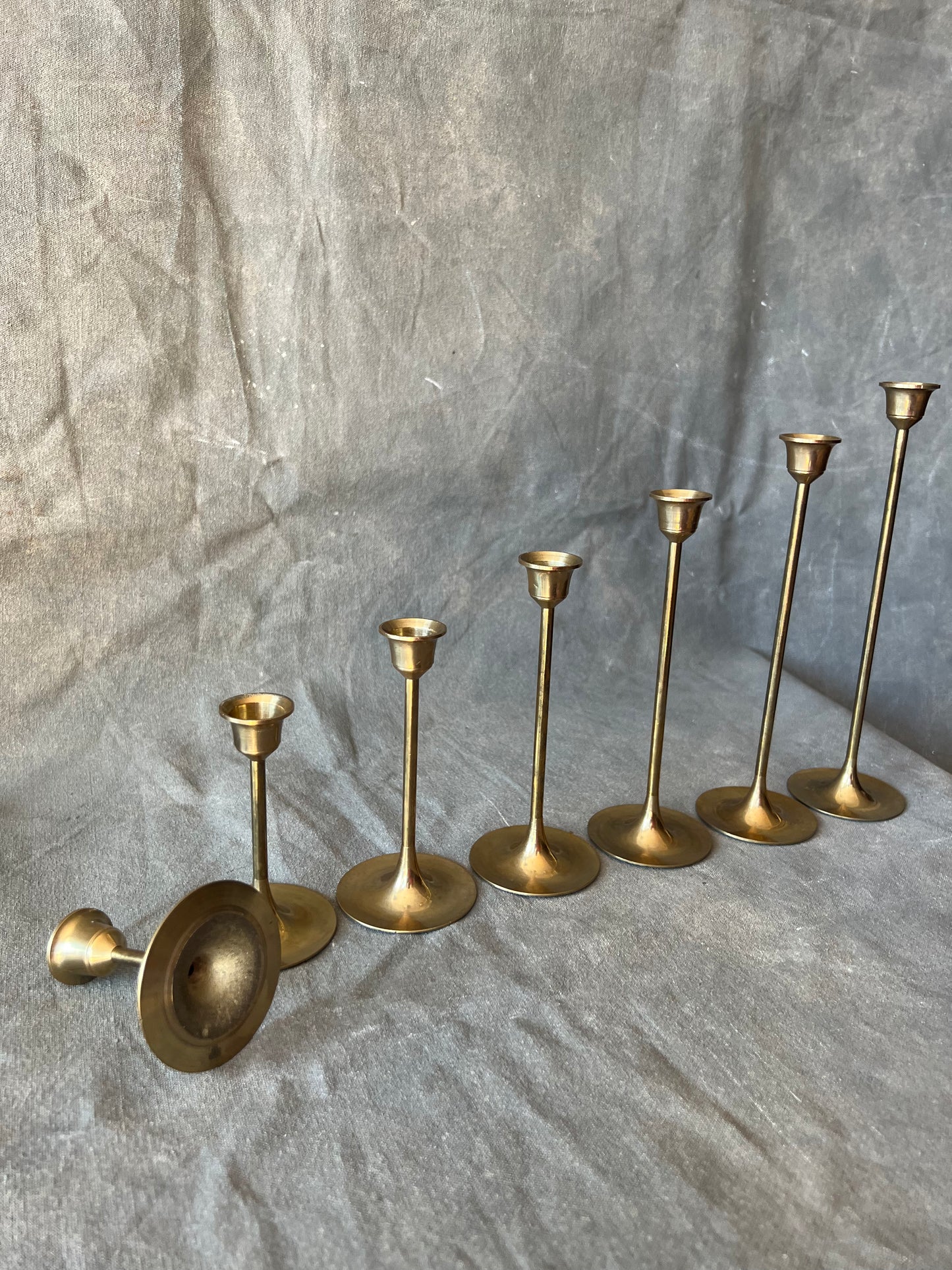 Set of Seven Slender Mid Century Brass Graduated Candle Holders